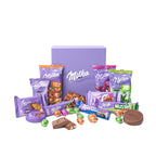 exclusief geschenk milka pasen met alle producten rond de doos en losse chocolade en koekjes