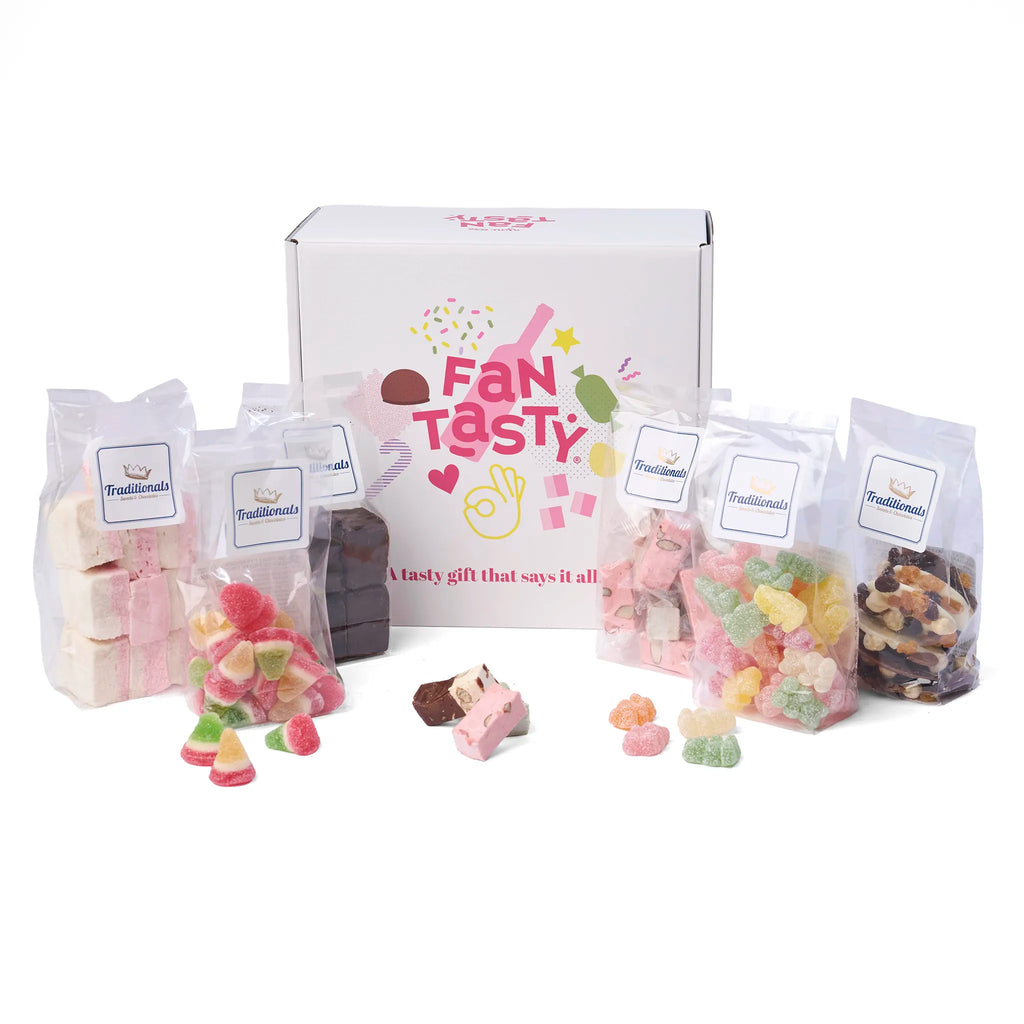 Sfeerbeeld van het Geschenk Traditionals Belgische Smaaksensaties met los snoepgoed en nougat naast de doos