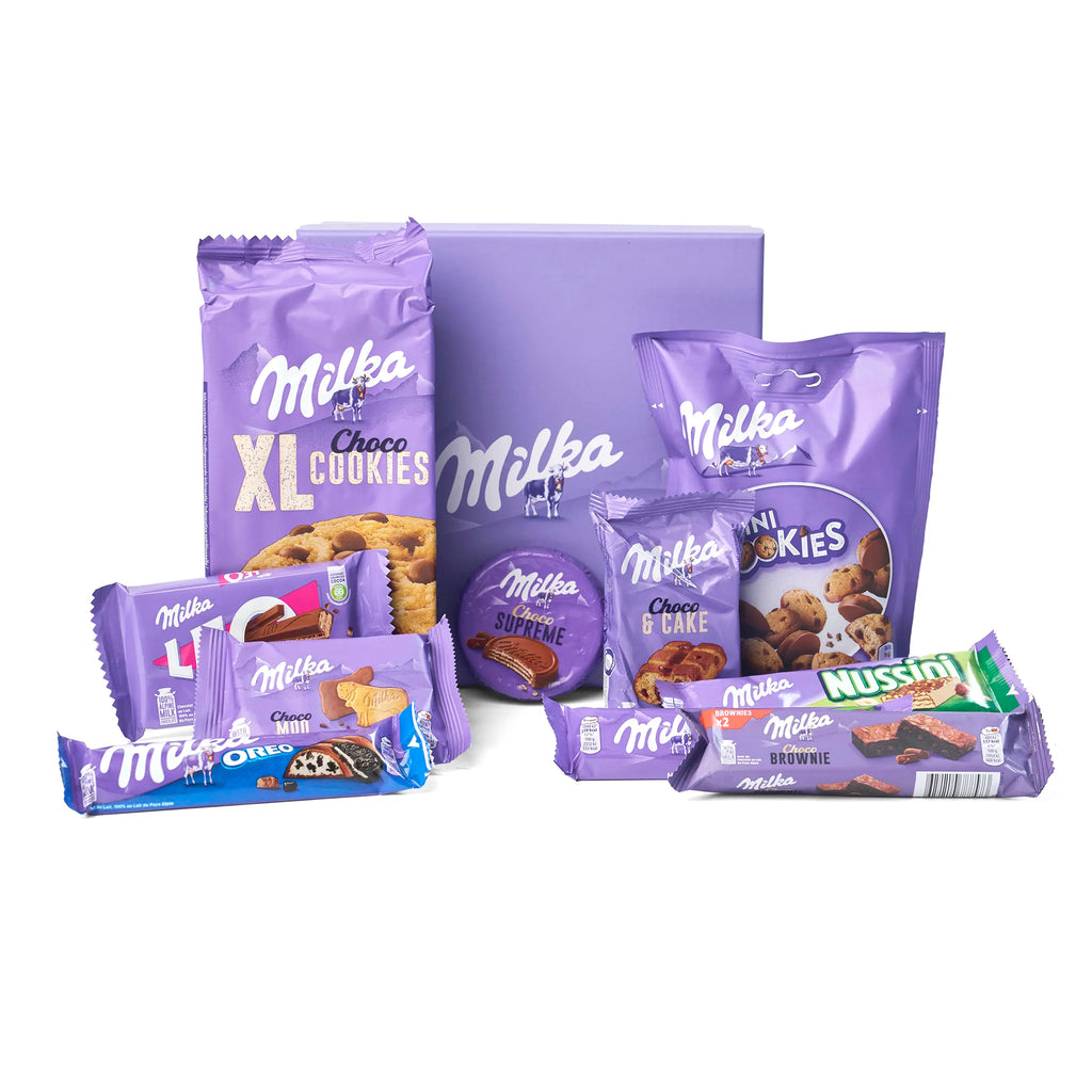 Alle producten uit de Milka Chocolate Gift Box Treasure uitgestald rondom de doos