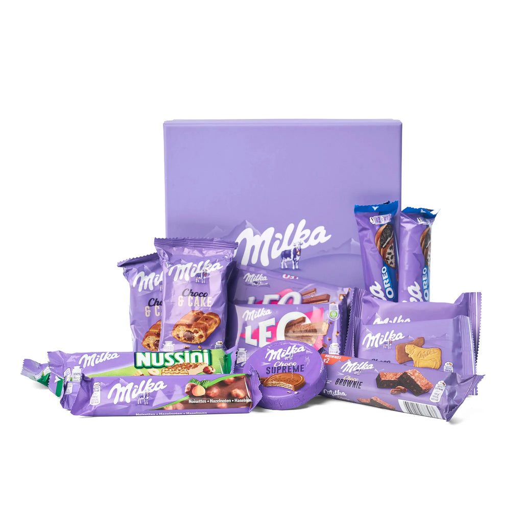 Alle producten uit de Milka Chocolate Gift Box Treats uitgestald rondom de doos